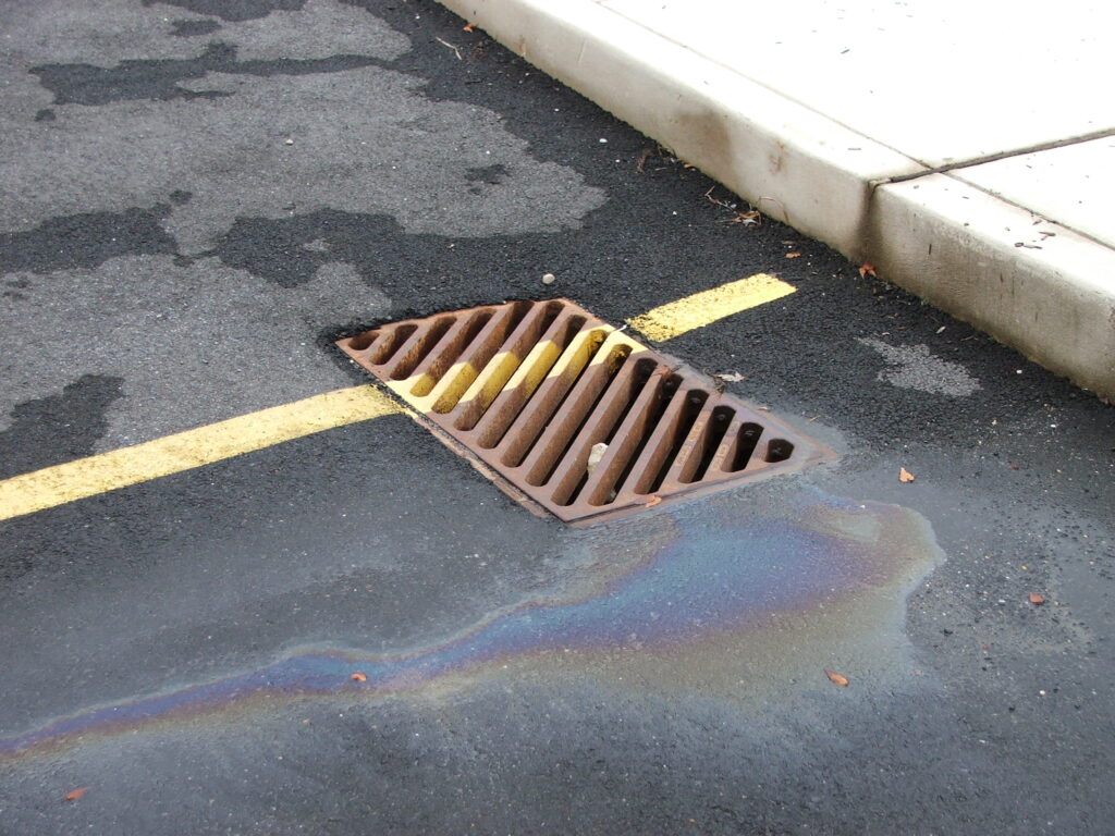 a drain in the middle of a parking lot